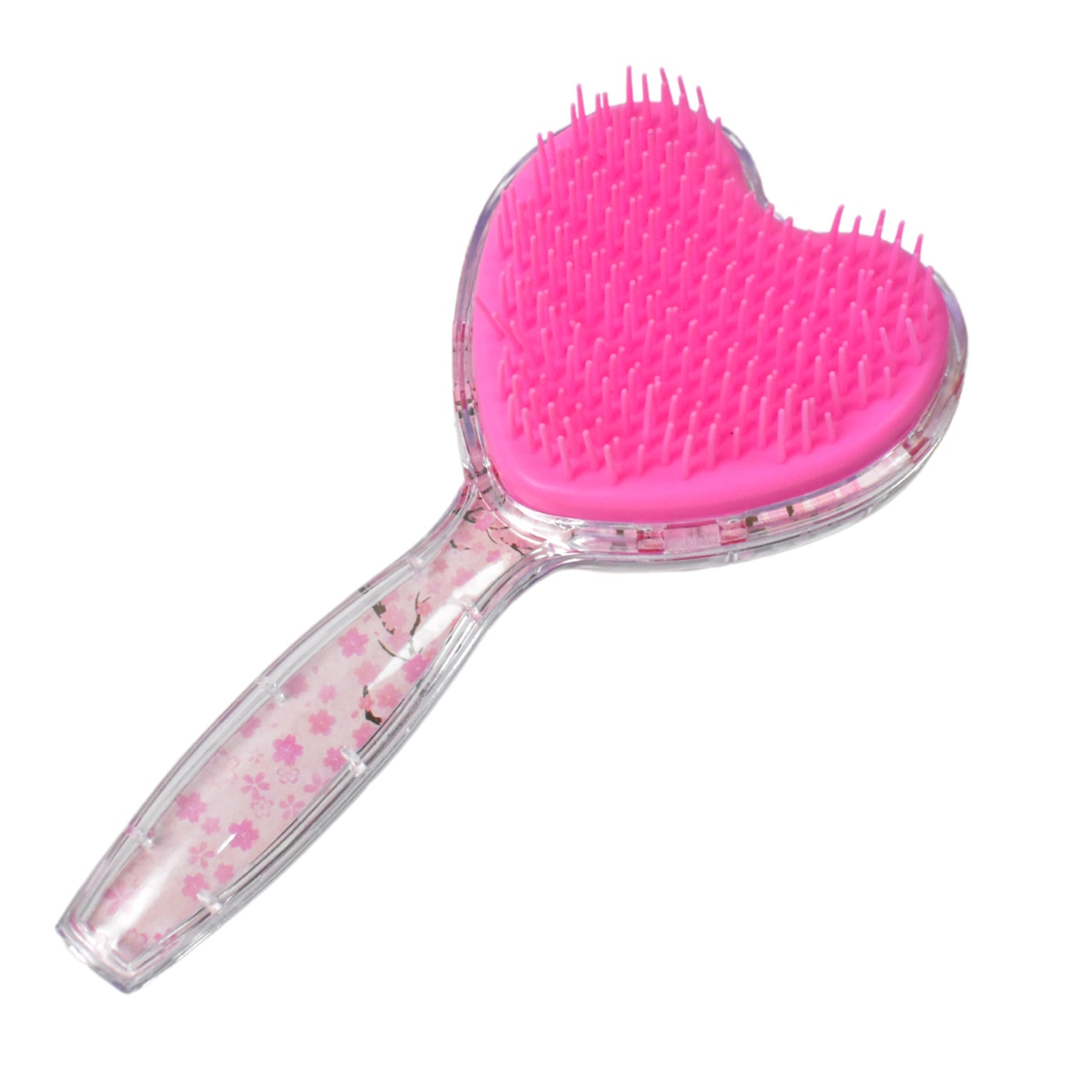 Front view of the heart-shaped massage comb, designed to stimulate the scalp.