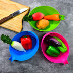 Three plastic food strainers with handles in various sizes, perfect for kitchen tasks.