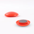 Easy-to-remove red magnetic board dots holding important notes
