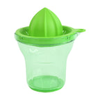 Clear container of Zest Ease Manual Citrus Juicer measuring fresh juice