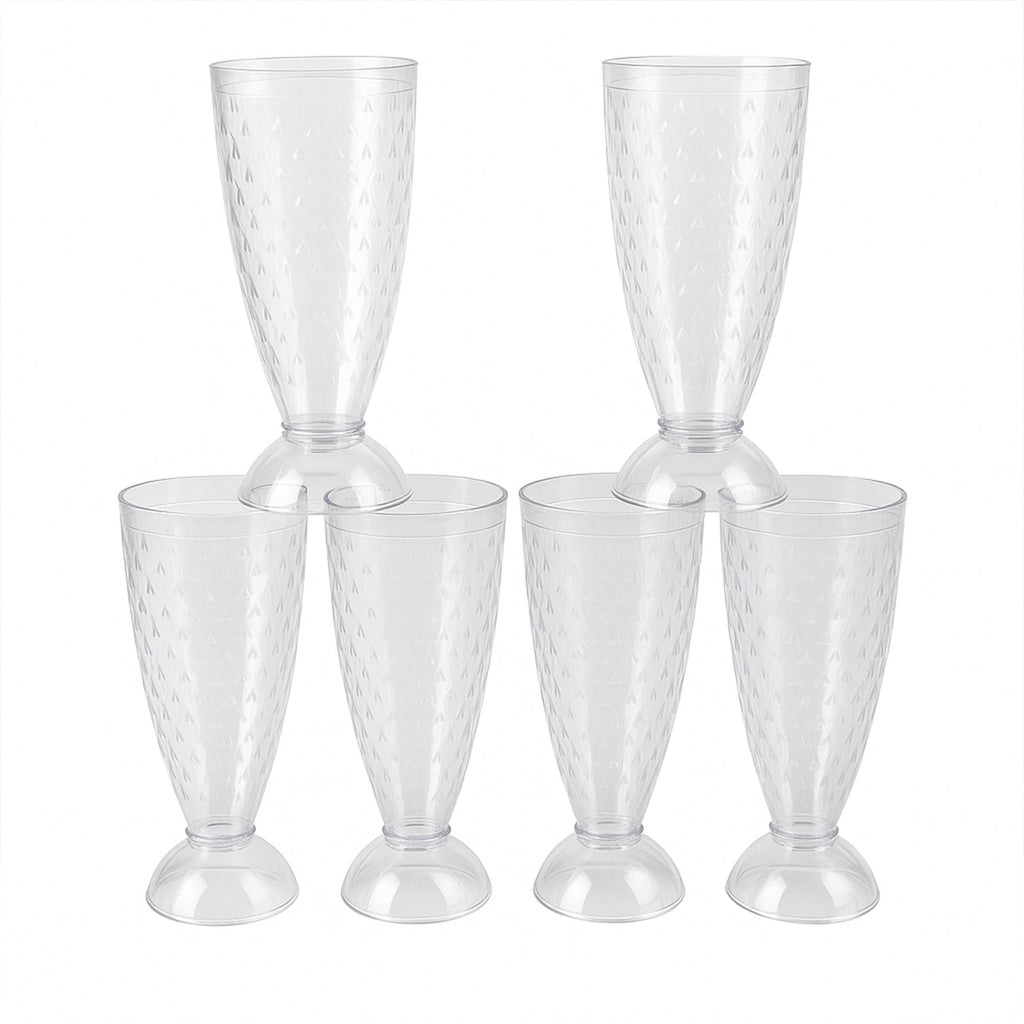 Transparent plastic milkshake glasses neatly arranged on a dining table