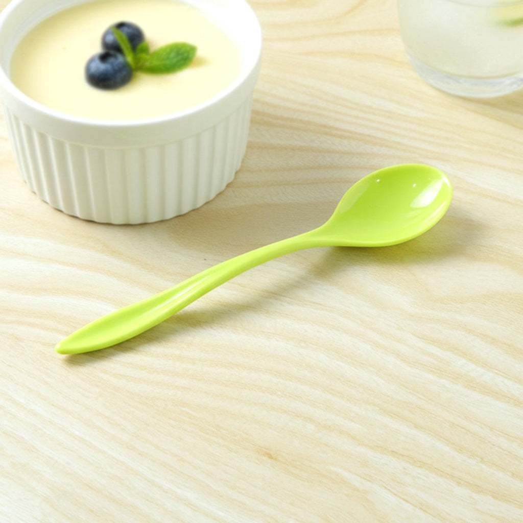 Detail shot of a plastic spoon's smooth handle, designed for comfortable grip.