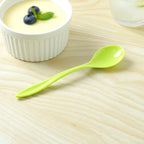 Detail shot of a plastic spoon's smooth handle, designed for comfortable grip.