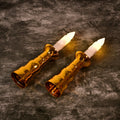 Pair of flameless LED candle lights with gold bases on a white background, perfect for Indian festive decor.