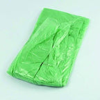 A hand holding the lightweight disposable raincoat, demonstrating its compact size.