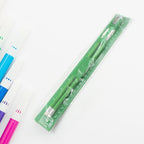 Ruler and pencils from the essential school supply set for precise work.