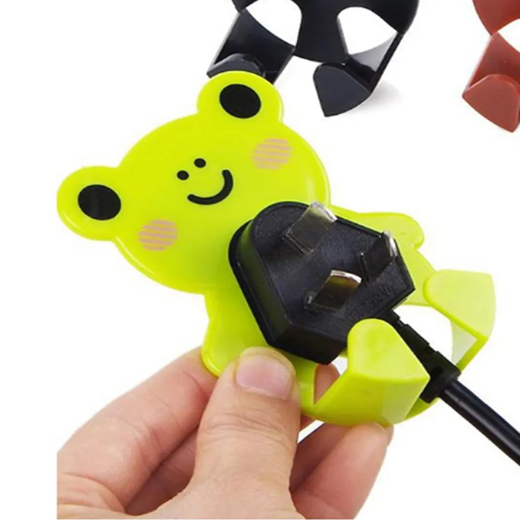 Close-up of adhesive cable holder with cables attached
