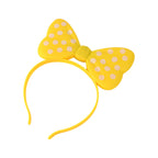 LED bow hairband glowing brightly in a dark setting