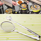 Hand holding the 2-in-1 frying filter spoon to show its size.