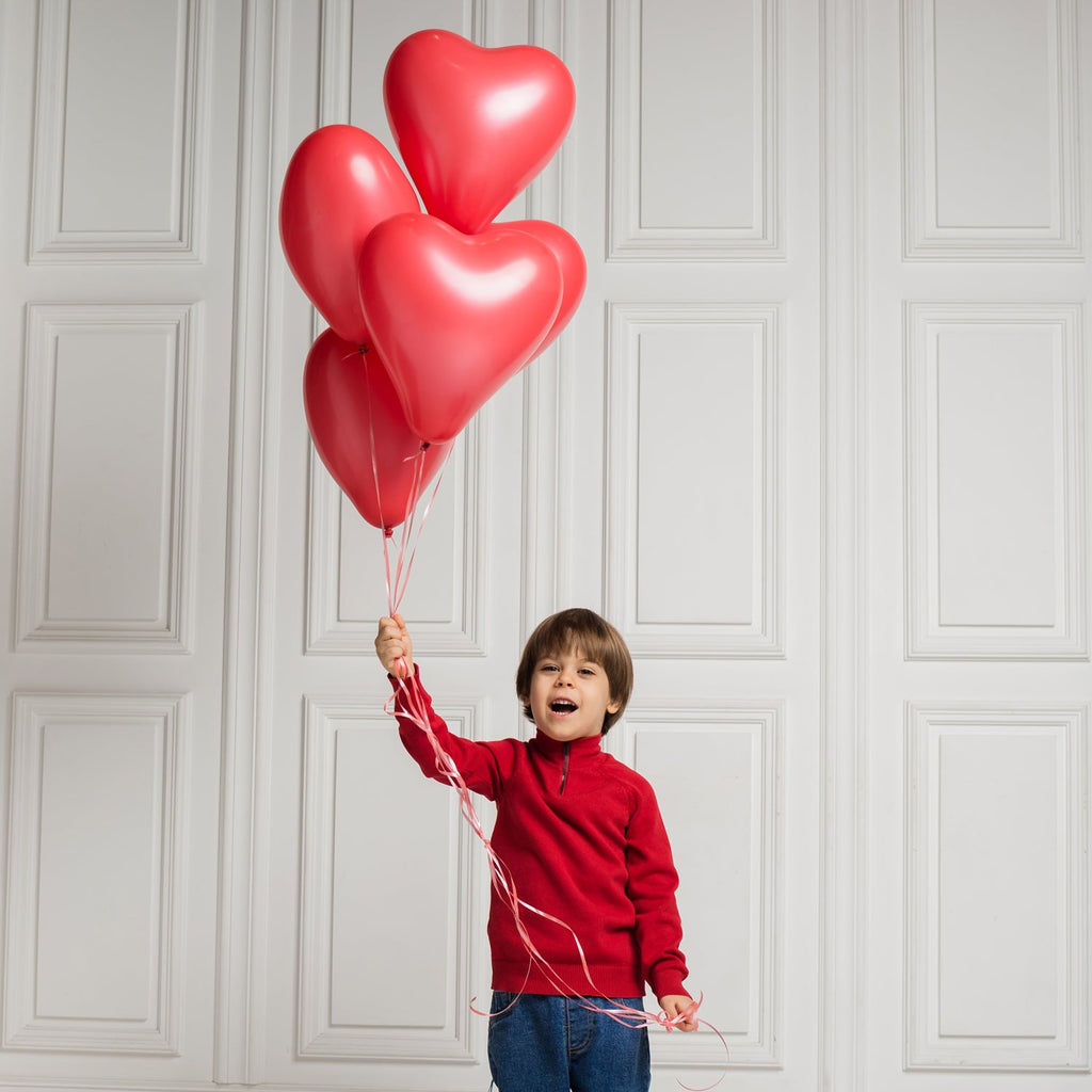 Assorted heart shaped balloons in bright colours, perfect for party decor.