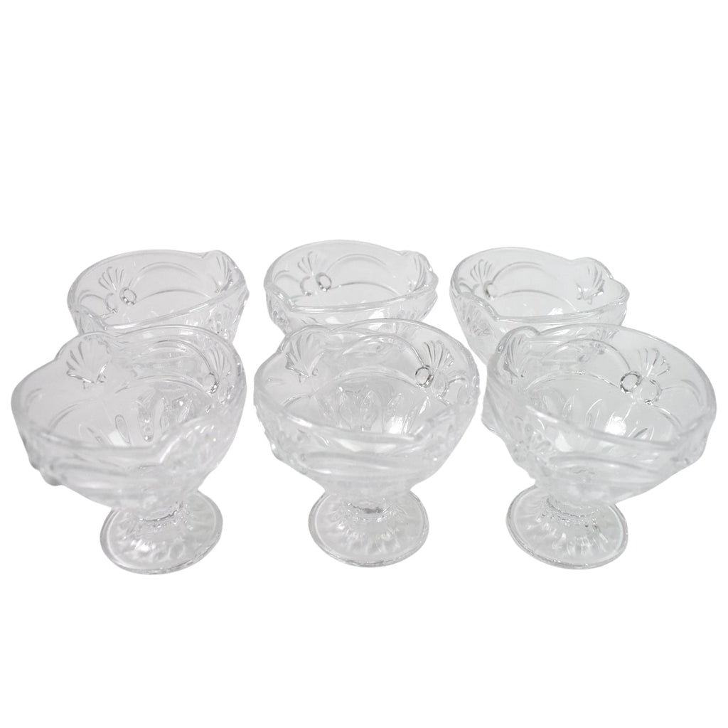 Variety of desserts like parfaits and sundaes beautifully presented in glass serving cups.