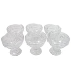 Variety of desserts like parfaits and sundaes beautifully presented in glass serving cups.