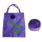 Close-up of the durable nylon fabric and detailed rose pattern on the foldable shopping bag.