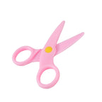 Overhead view of ergonomic child safety scissors, perfect for early learning activities.
