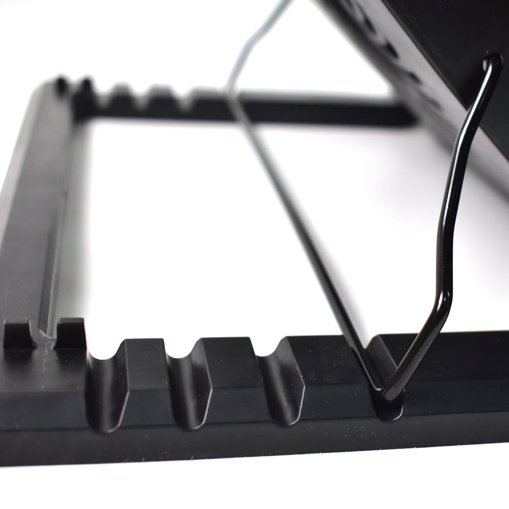 Laptop cooling fan pad with blue LED lights, enhancing the gaming setup.