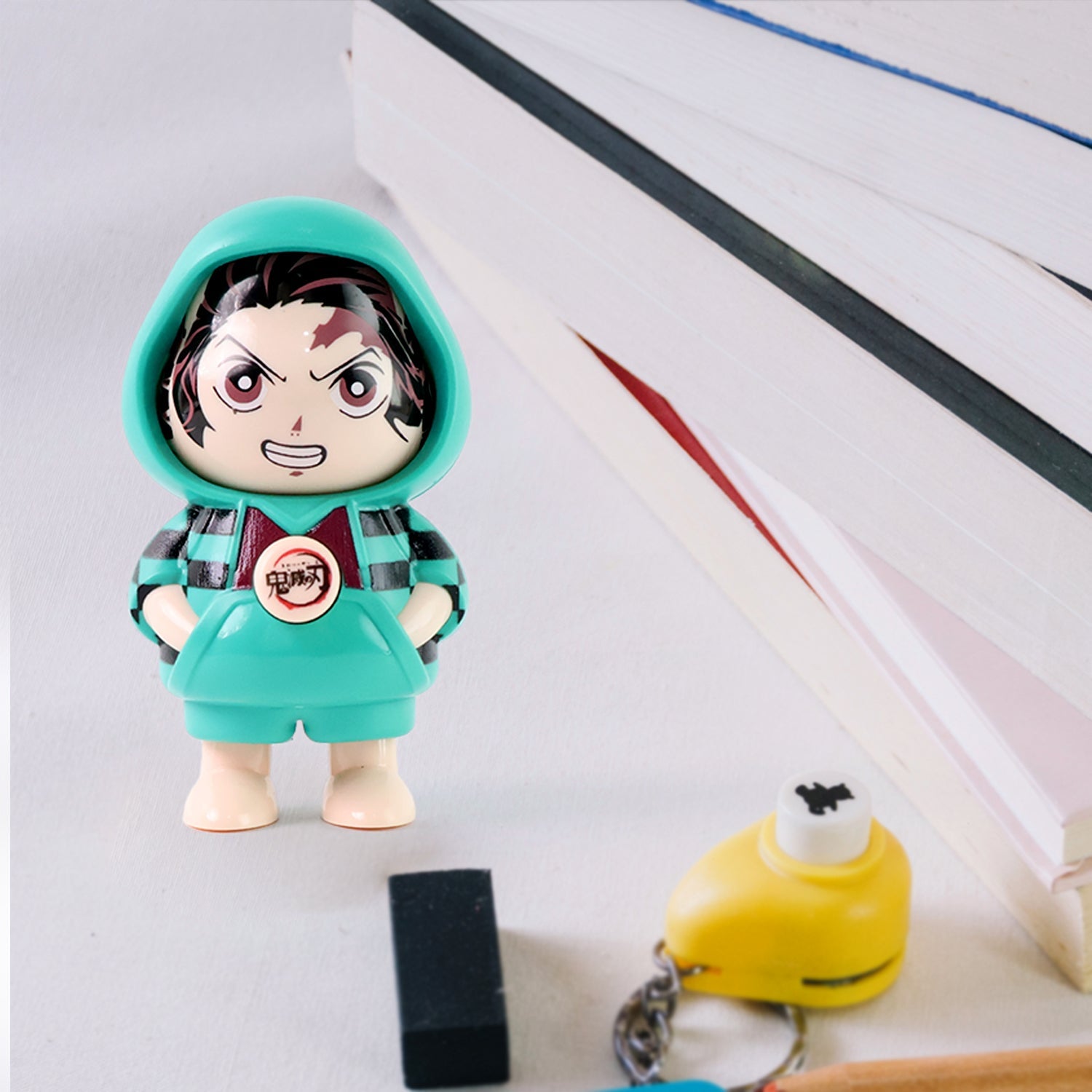 PVC cartoon figure keychain featuring varied facial expressions
