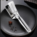 Stainless steel multifunction cooking tong with oil-draining slots.