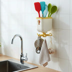 Rotatable sticky wall hook hanging multiple household items securely
