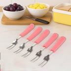 Close-up view of sharp two-prong stainless steel fruit forks