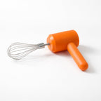 Handheld electric whisk mixer in kitchen mixing ingredients