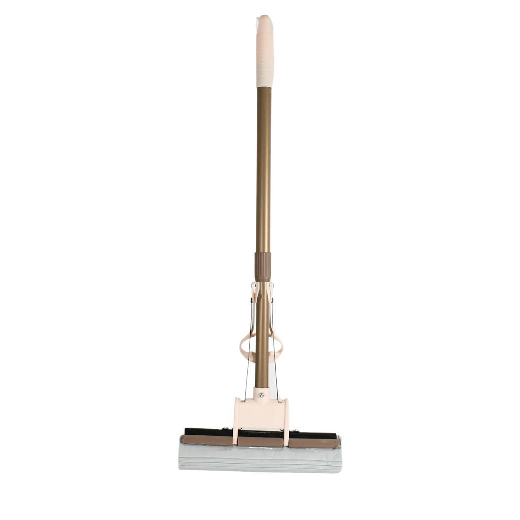 A user effortlessly cleaning a floor with the self-cleaning sponge mop, highlighting its maneuverability.