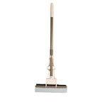 A user effortlessly cleaning a floor with the self-cleaning sponge mop, highlighting its maneuverability.