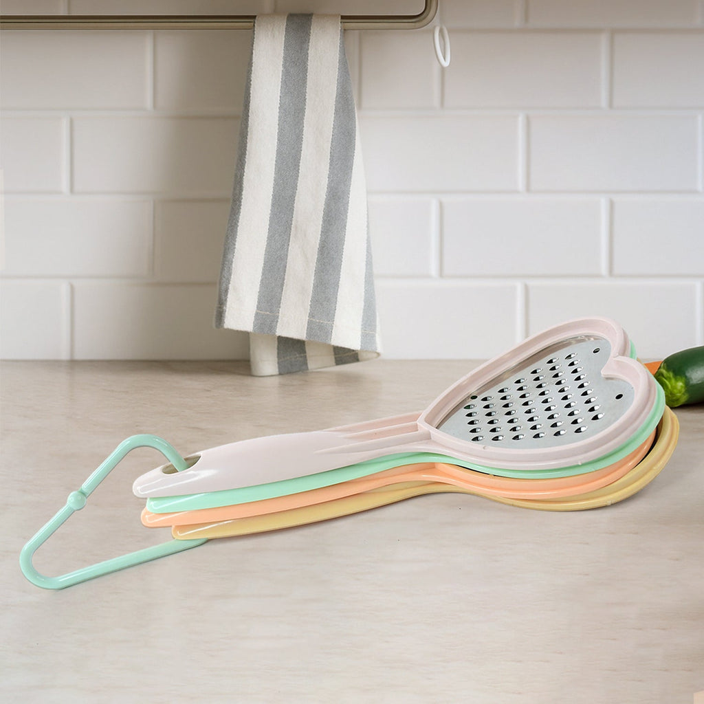 Detailed view of the durable plastic outline and steel blades of the Home Chef heart kitchen tool.
