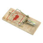 Old-school snap mouse trap made of wood ready to capture mice