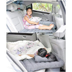 Full view of the portable inflatable car bed, pump, and pillows kit.