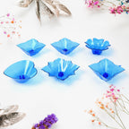 The elegant plastic candle holders from the Diwali Diya Set displayed on a surface.