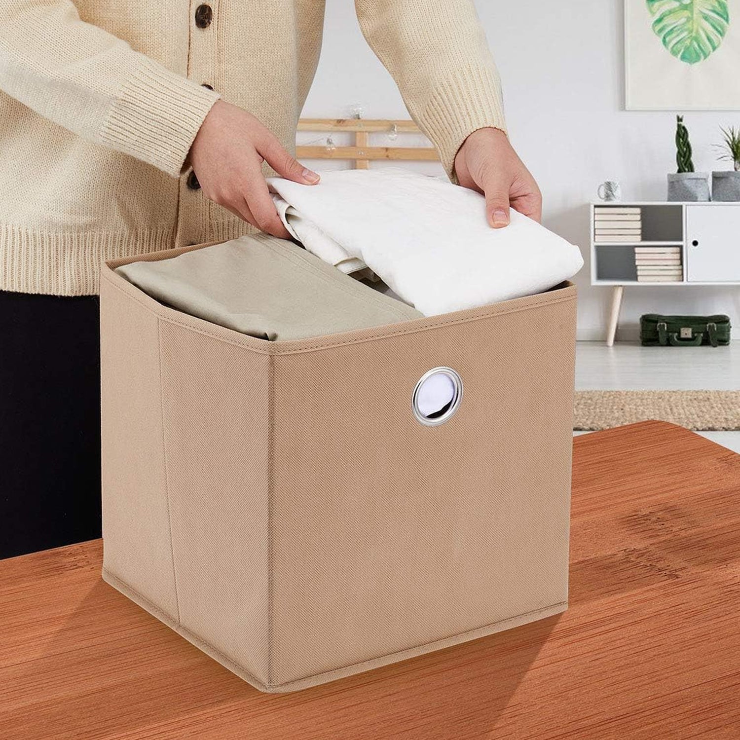 Stacked foldable storage boxes designed to organise clothes and accessories