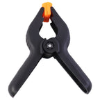 Compact heavy duty spring clamp with ergonomic handle for workshop use