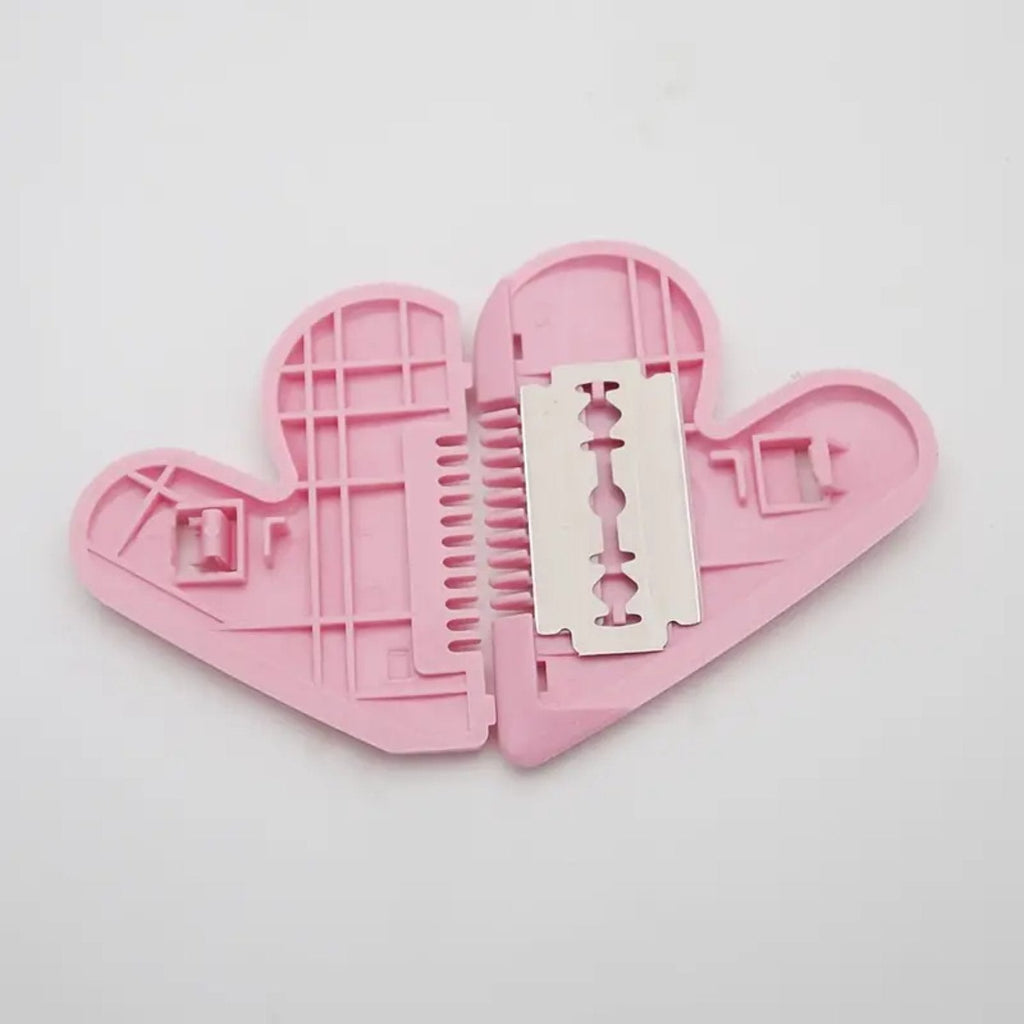 Heart-shaped safety trimming scissors on a clean surface