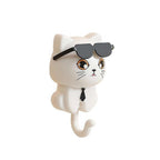 Hand holding the Styleva cat wall hook, highlighting its smooth finish and convenient size.