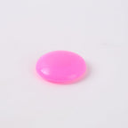 Set of pink plastic tack board magnet buttons displayed