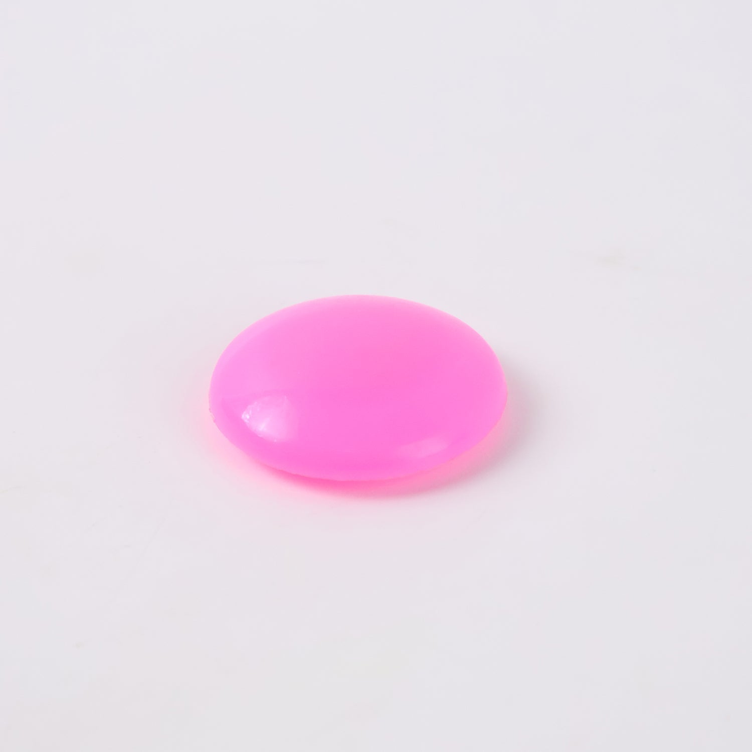 Set of pink plastic tack board magnet buttons displayed