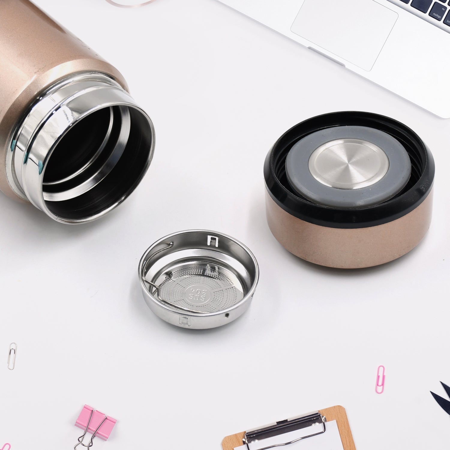 Travel-size stainless steel vacuum bottle with secure lid