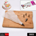 A professional Cake Decorating Nozzle Set with various stainless steel tips and clear disposable piping bags.