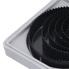 Multiple carbon steel hole saws of different diameters, highlighting the range available in the kit.