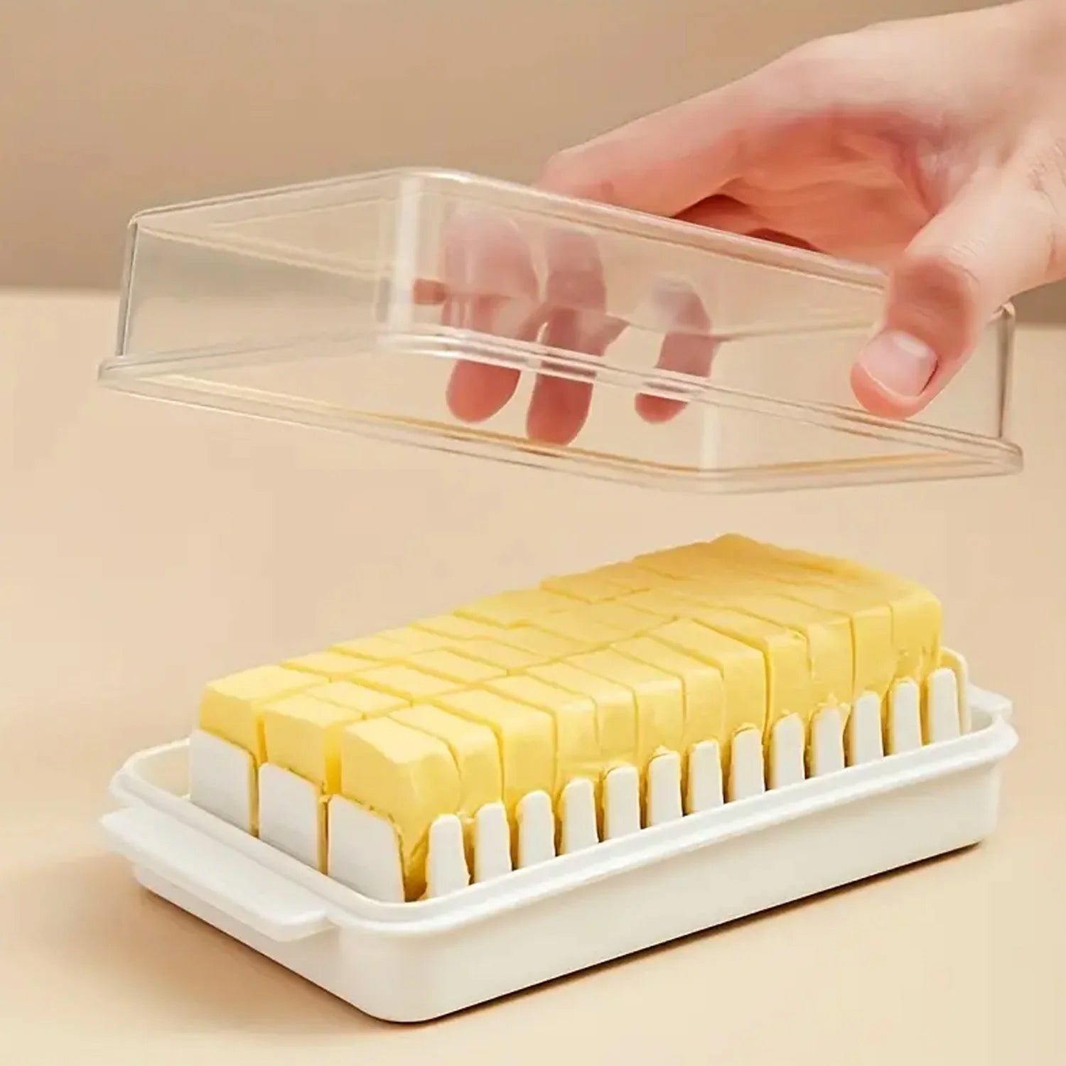 Front view of the transparent Butter Slicer Box by Organivo, ready for use.