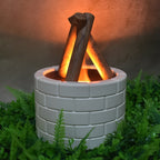 Detailed view of the Flame Diffuser's mist outlet and glowing bonfire light.