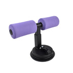 A person performing effective core workouts using the FitFuzion Suction Sit-Up Tool at home.