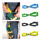 Glove clip holder attached to a belt, securing a small tool bag.