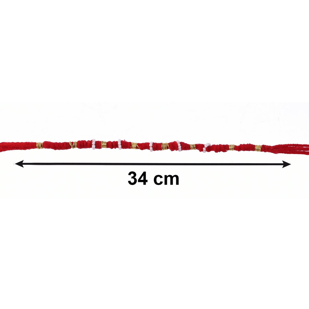 Close-up of red rakhi with beads and pearl accents