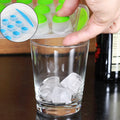 A vibrant blue round silicone ice cube tray filled with perfectly formed mini ice cubes.