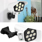 AutoSafeo dummy security camera light with solar panel installed on a home exterior.