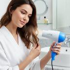 Dual speed hair dryer with ergonomic grip