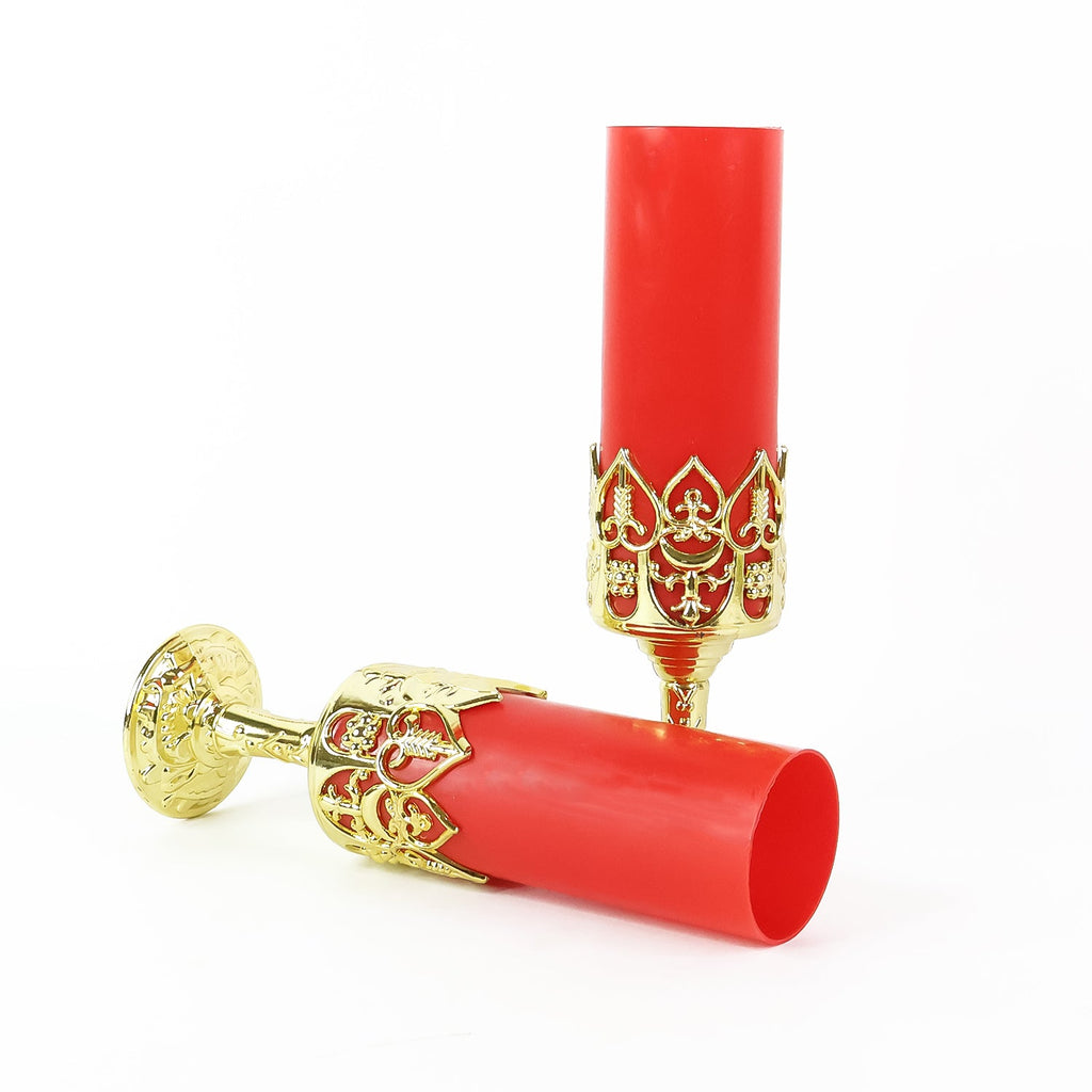 Battery-operated LED candle light emitting ambient glow on golden stand