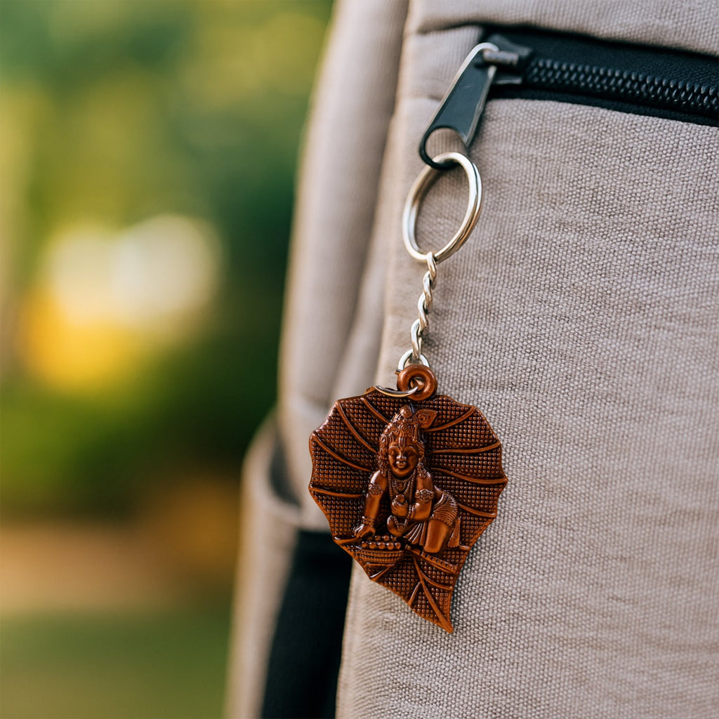 Detailed charm showing Bal Krishna on antique bronze keychain