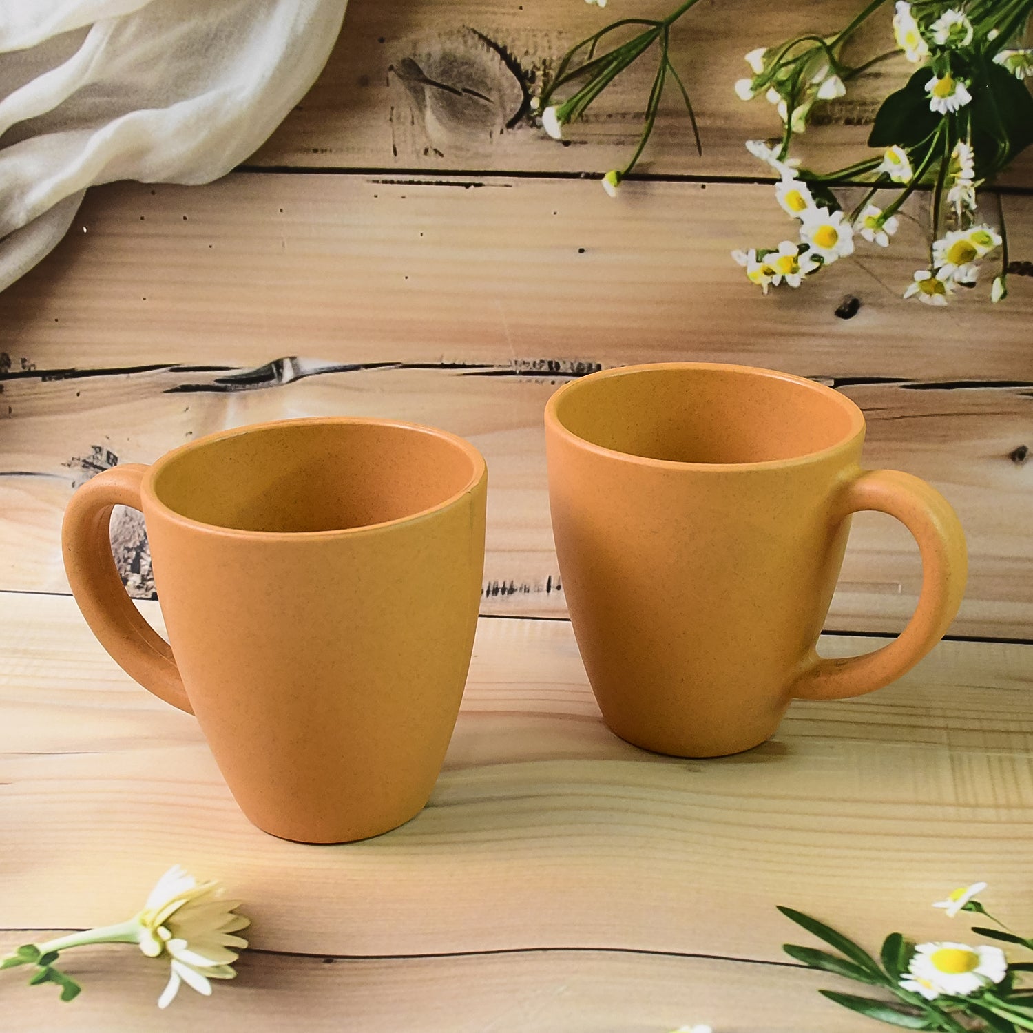 Konvex coffee mugs placed on a wooden table